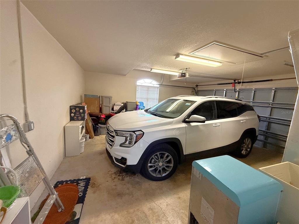 4980 Southeast 47th Terrace Road Ocala, FL 34480 - Photo 38 of 54 a car parked in a garage