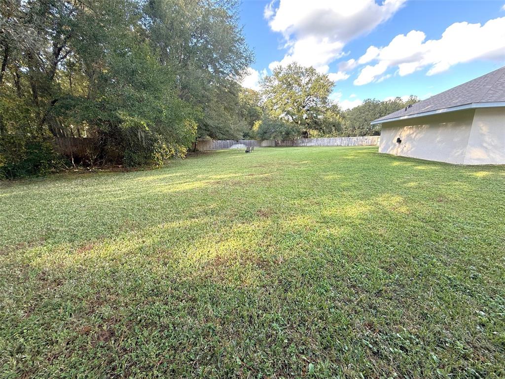 4980 Southeast 47th Terrace Road Ocala, FL 34480 - Photo 43 of 54 a view of a backyard