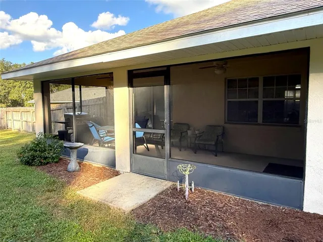 a front view of a house with swimming pool and porch