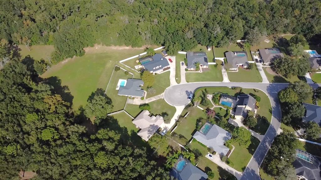 4980 Southeast 47th Terrace Road Ocala, FL 34480 - Photo 52 of 54 an aerial view of a house with a lake view