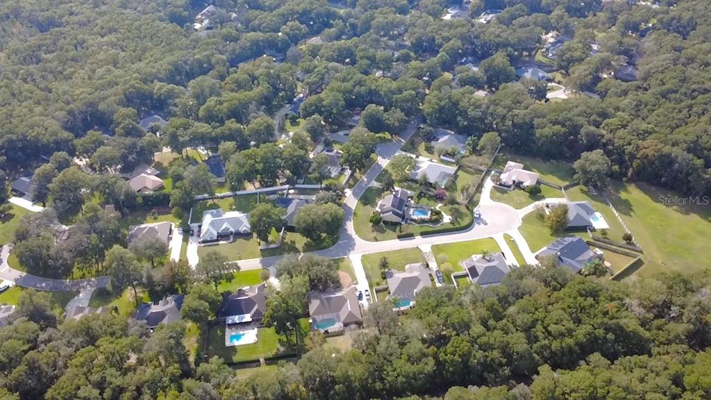 4980 Southeast 47th Terrace Road Ocala, FL 34480 - Photo 54 of 54 an aerial view of residential house with outdoor space and swimming pool