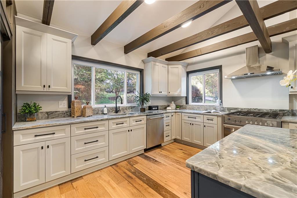 1836 Kent Road Pittsburgh, PA 15241 - Photo 12 of 50 a kitchen with granite countertop cabinets stainless steel appliances a sink and a large window