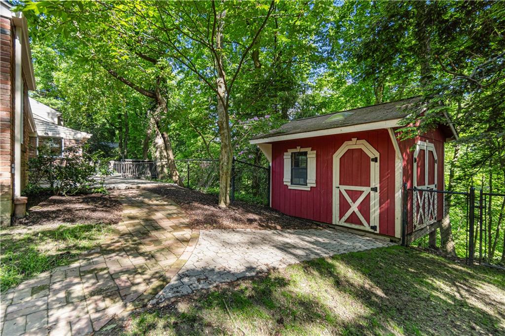 1836 Kent Road Pittsburgh, PA 15241 - Photo 47 of 50 a view of a backyard with large trees and plants
