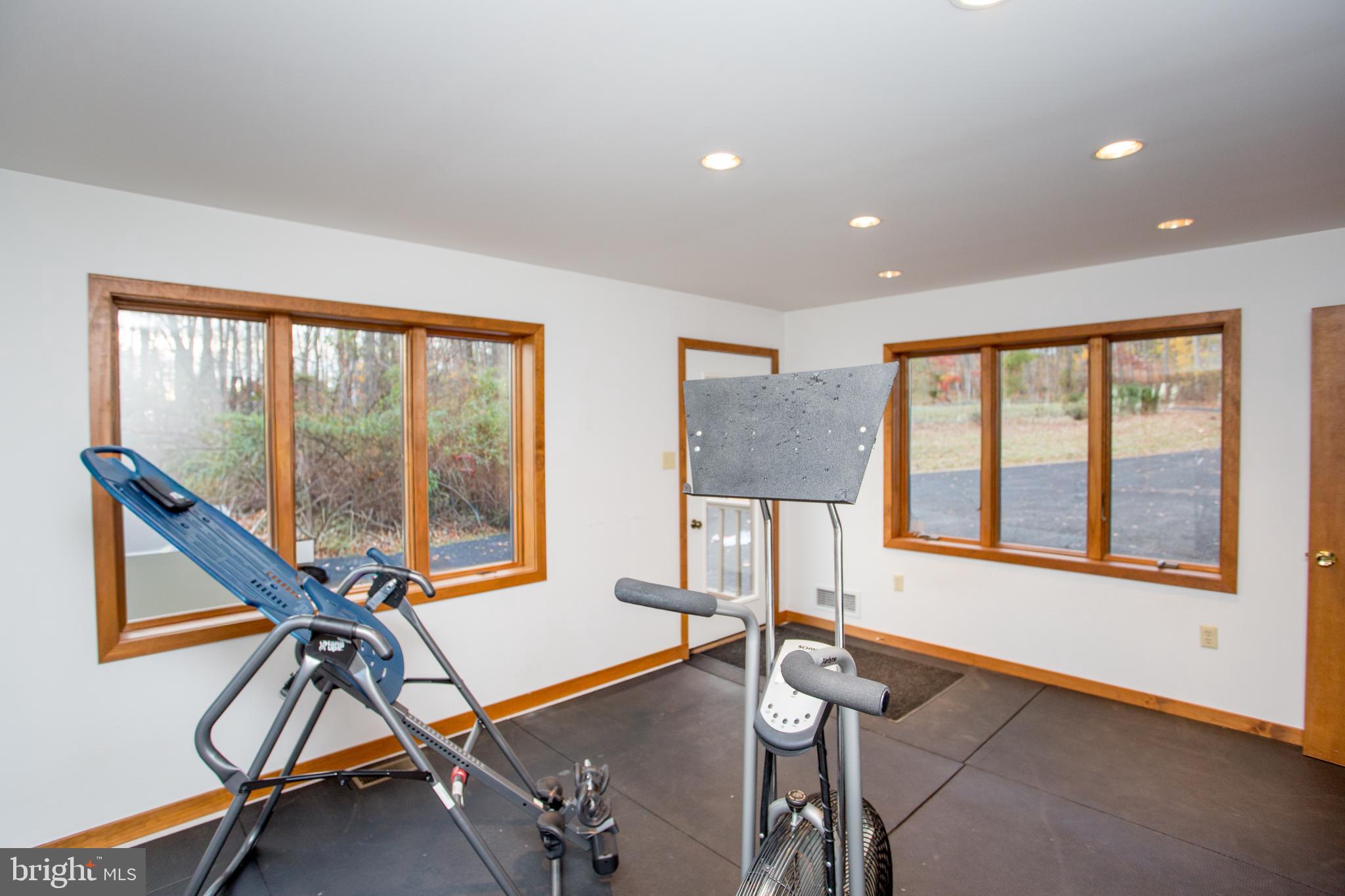 786 Ridge Road Telford, PA 18969 - Photo 81 of 105 a view of a room with gym equipment and windows