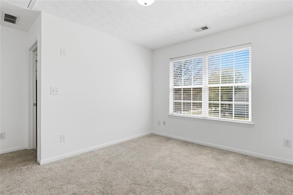 640 Howell Drive Locust Grove, GA 30248 - Photo 17 of 41 an empty room with a window