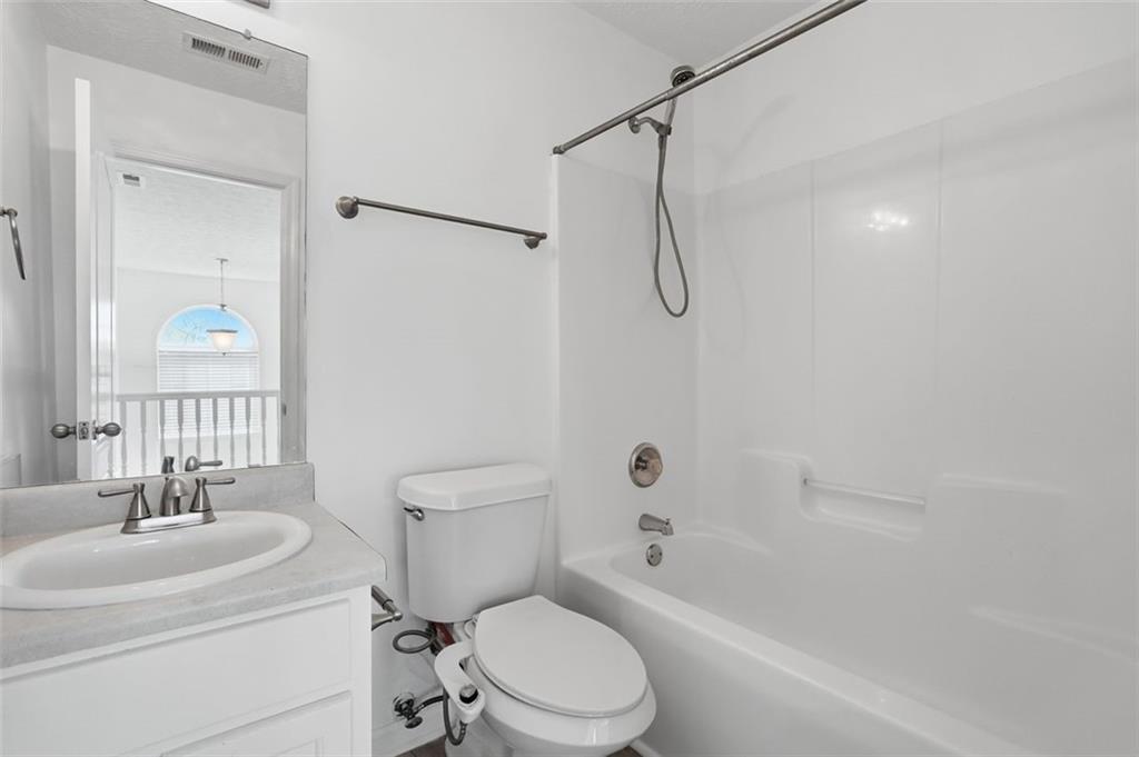 640 Howell Drive Locust Grove, GA 30248 - Photo 18 of 41 a bathroom with a sink toilet and shower