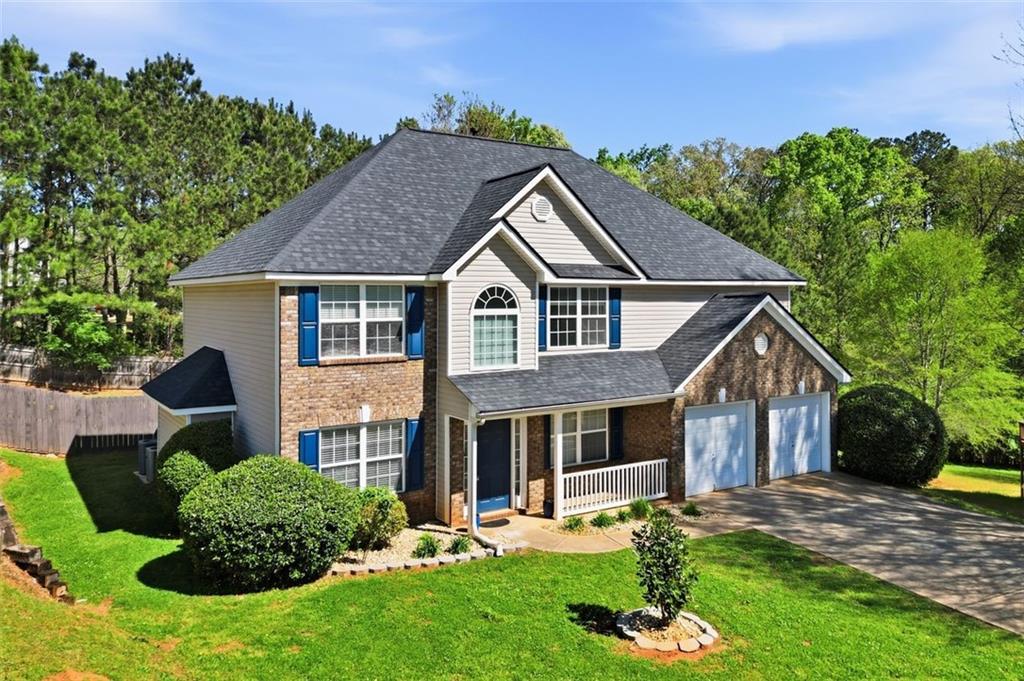 640 Howell Drive Locust Grove, GA 30248 - Photo 2 of 41 a front view of house with yard and green space