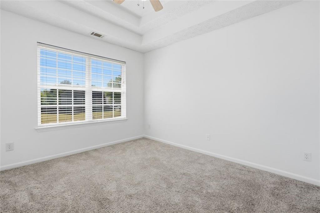 640 Howell Drive Locust Grove, GA 30248 - Photo 21 of 41 an empty room with a window