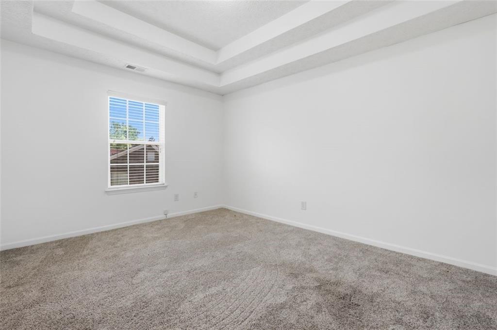 640 Howell Drive Locust Grove, GA 30248 - Photo 24 of 41 an empty room with windows