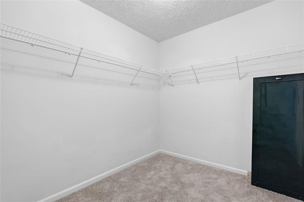 640 Howell Drive Locust Grove, GA 30248 - Photo 28 of 41 a view of a room with racks on the wall