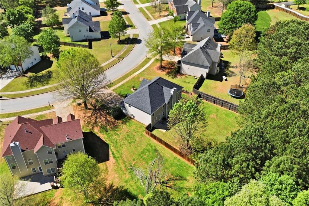 640 Howell Drive Locust Grove, GA 30248 - Photo 34 of 41 an aerial view of residential house with outdoor space and swimming pool