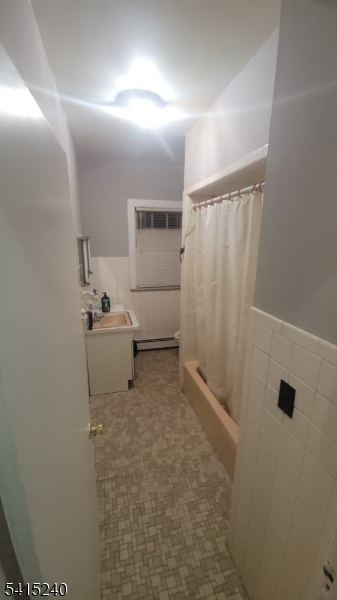 116 Elmora Avenue Elizabeth, NJ 07202 - Photo 5 of 5 a bathroom with a sink toilet and shower