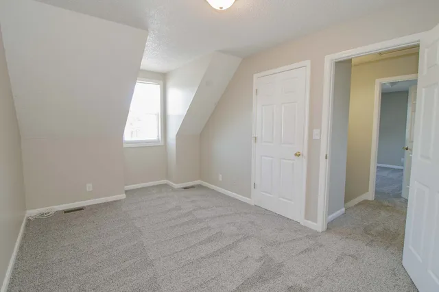 an empty room with closet area