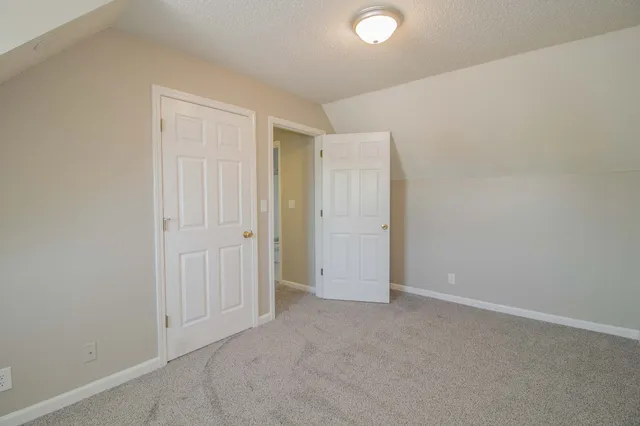 an empty room with a empty space and window