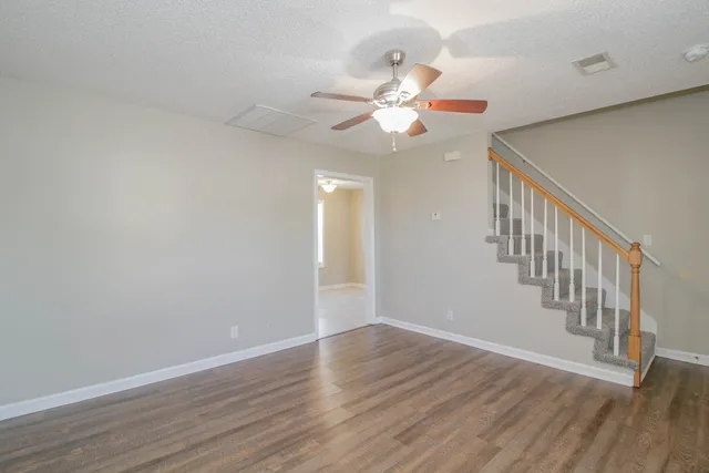 a view of an entryway with wooden floor