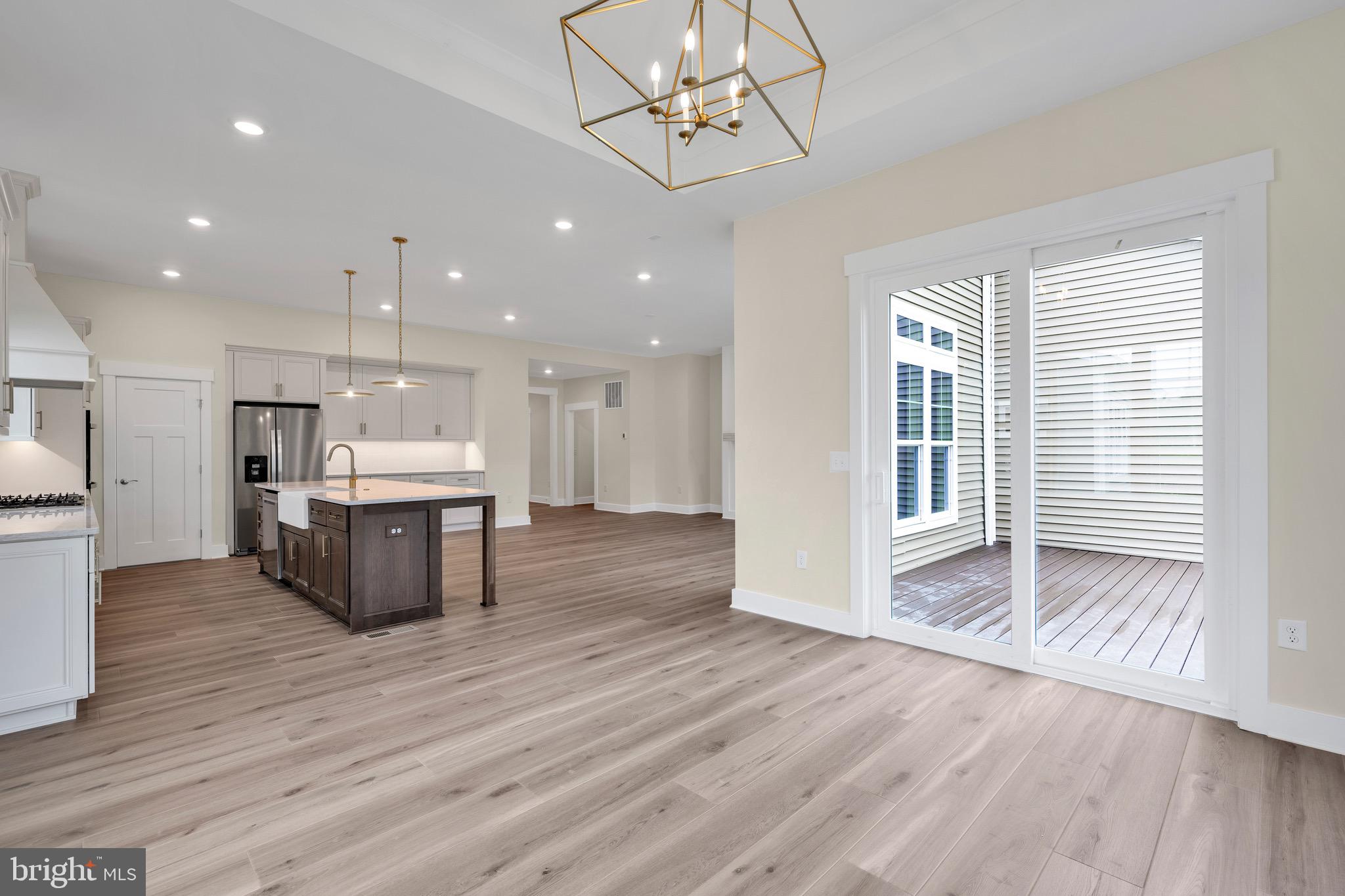 23412 East Gate Drive Frankford, DE 19945 - Photo 15 of 28 a view of kitchen with wooden floor and electronic appliances