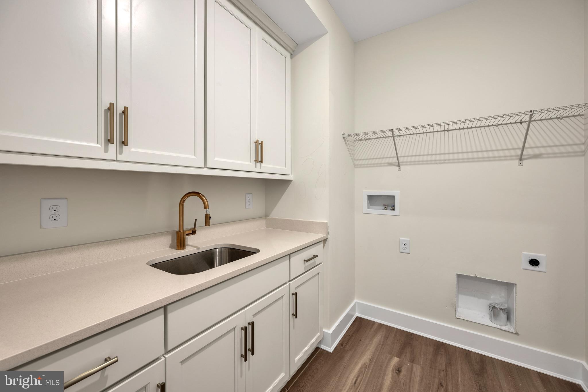 23412 East Gate Drive Frankford, DE 19945 - Photo 23 of 28 a kitchen with a sink and cabinets