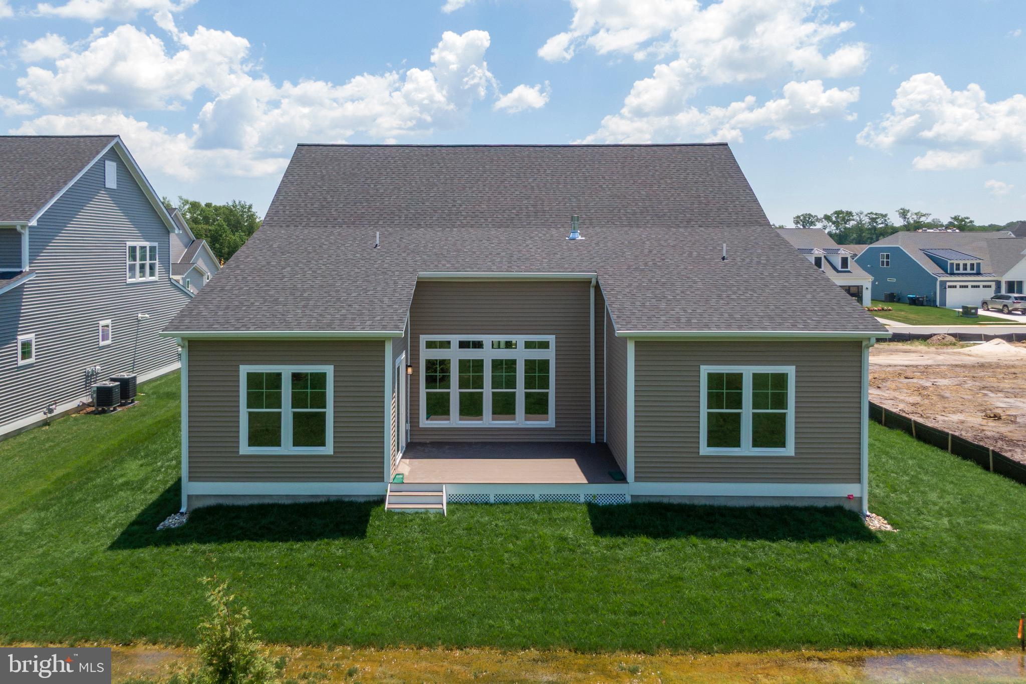 23412 East Gate Drive Frankford, DE 19945 - Photo 28 of 28 front view of a house with a yard