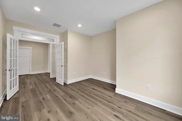 a view of wooden floor in an empty room