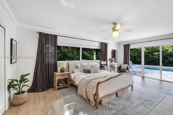 a bedroom with furniture and a window