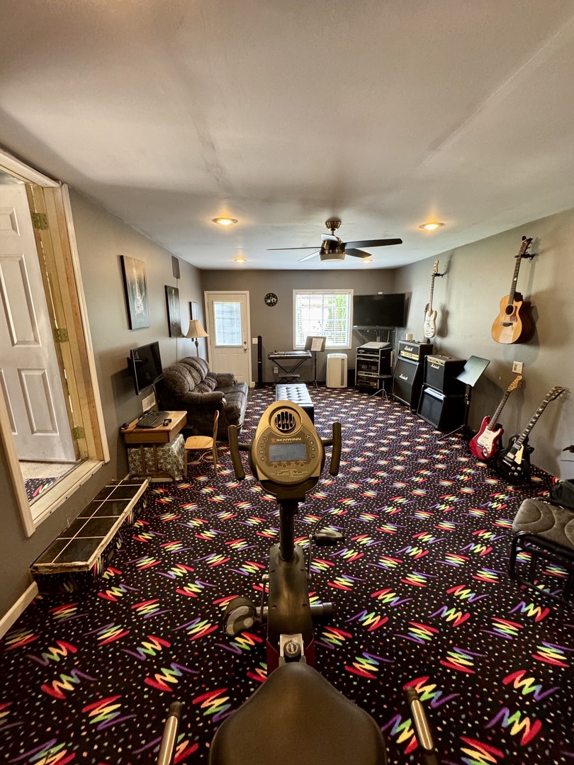 301 West Jackson Street Ohio, IL 61349 - Photo 14 of 32 a living room with furniture a rug and a chandelier