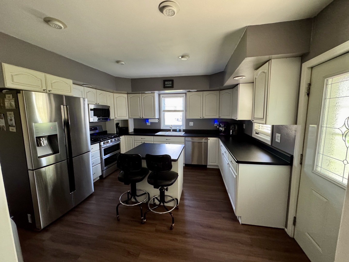 301 West Jackson Street Ohio, IL 61349 - Photo 18 of 32 a kitchen with a refrigerator a sink dishwasher a stove and a refrigerator