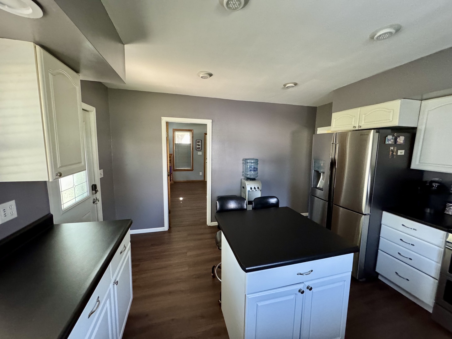 301 West Jackson Street Ohio, IL 61349 - Photo 19 of 32 a kitchen with granite countertop a refrigerator and a stove