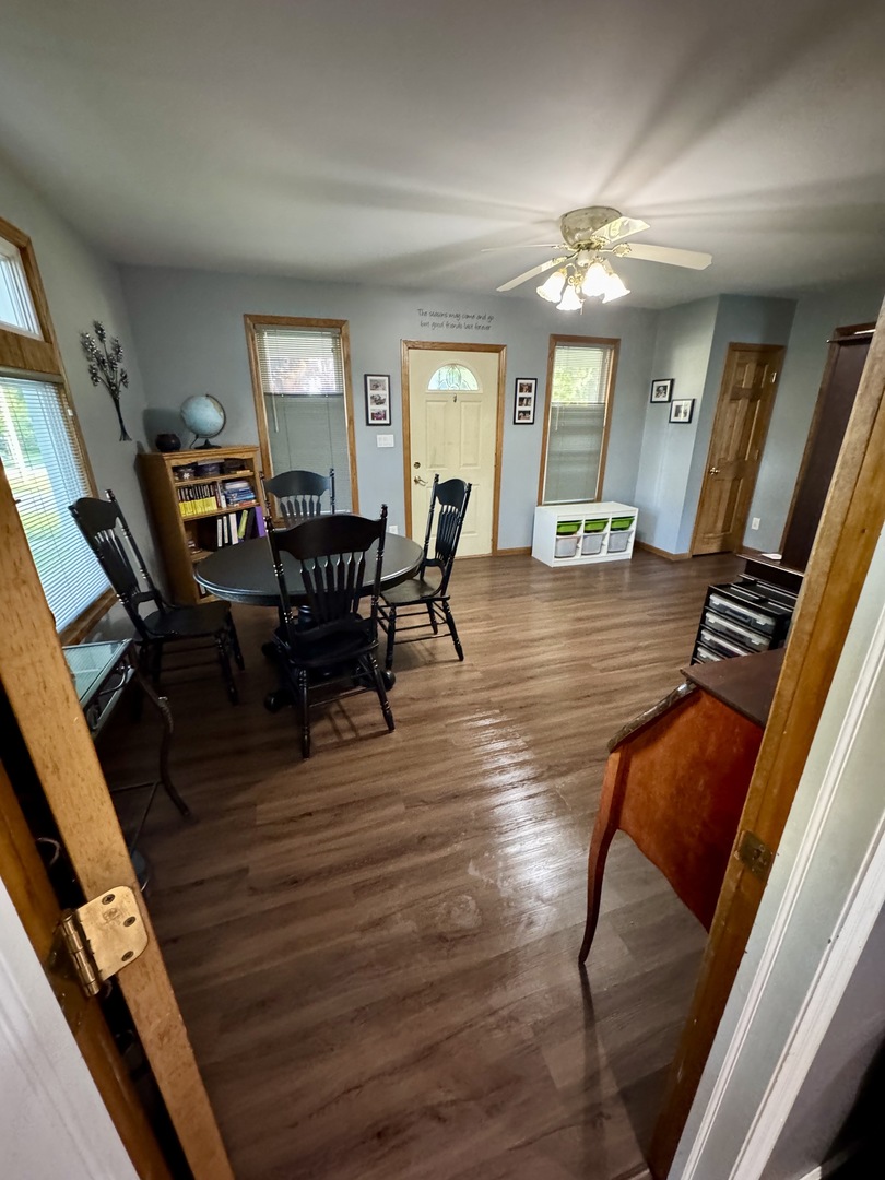 301 West Jackson Street Ohio, IL 61349 - Photo 20 of 32 a view of a dining room with furniture and wooden floor