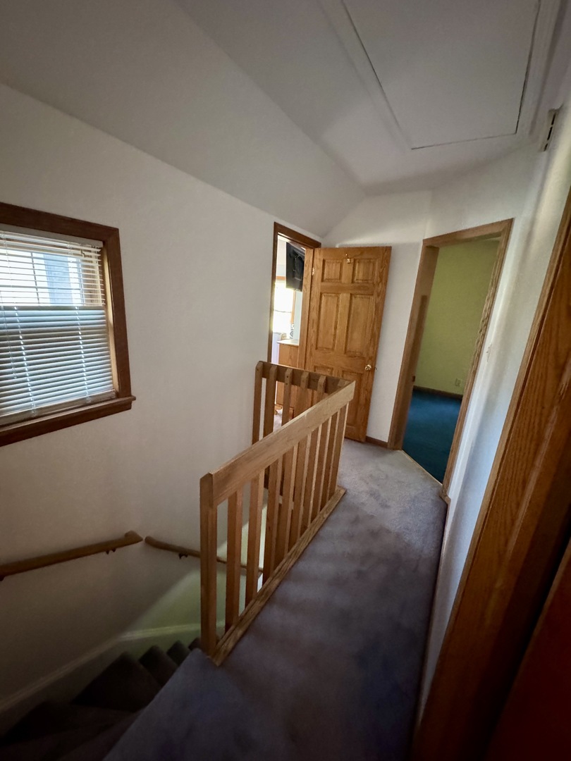 301 West Jackson Street Ohio, IL 61349 - Photo 24 of 32 a view of an empty room with wooden floor and windows