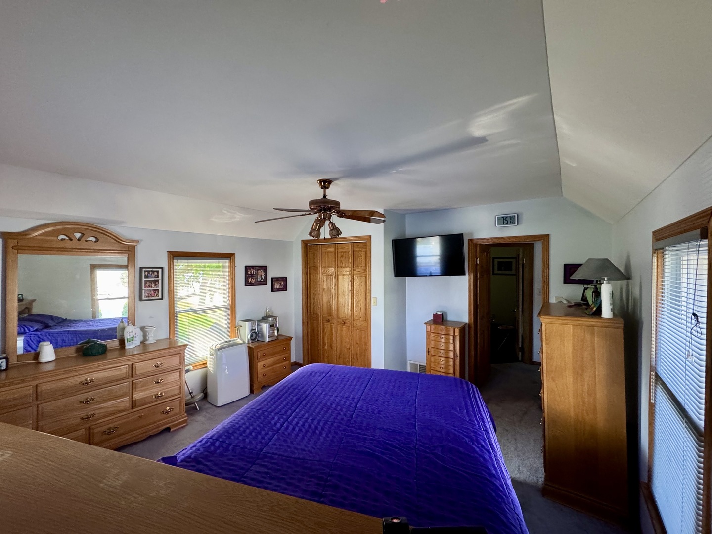 301 West Jackson Street Ohio, IL 61349 - Photo 28 of 32 a bedroom with a large bed a flat tv screen and large closet