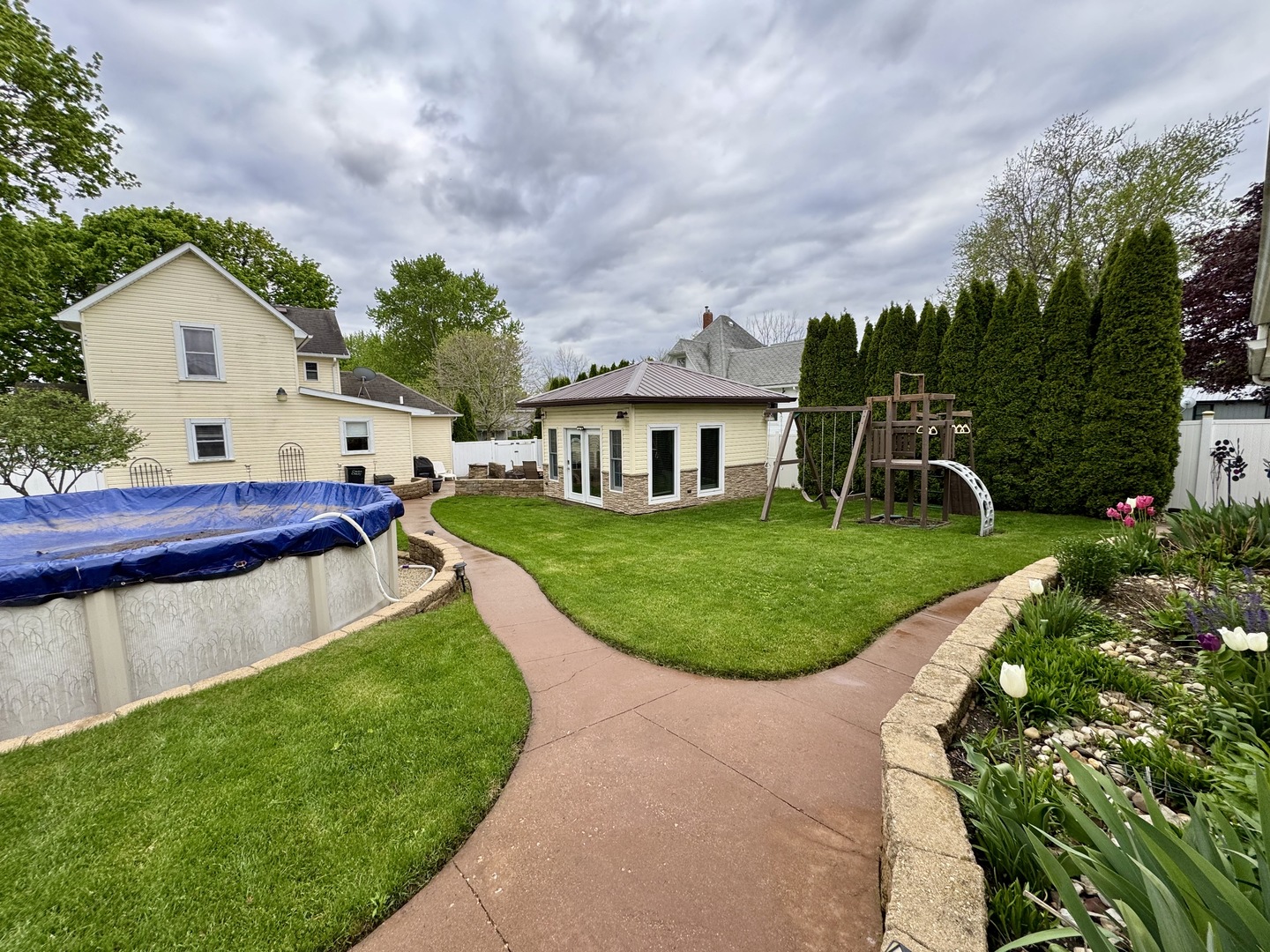 301 West Jackson Street Ohio, IL 61349 - Photo 3 of 32 a view of a house with a backyard and a patio