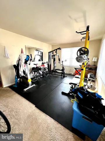 a living room with lots of furniture and clutter