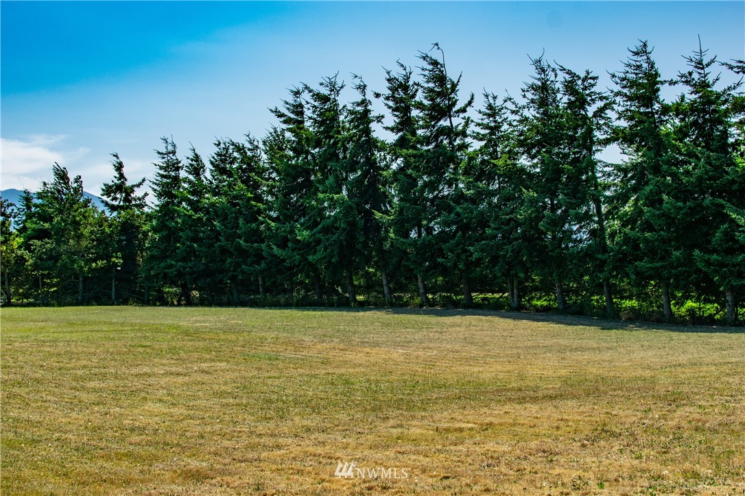 9999 Donaper Road Sequim, WA 98382 - Photo 9 of 24 a view of a swimming pool with an outdoor space and seating area
