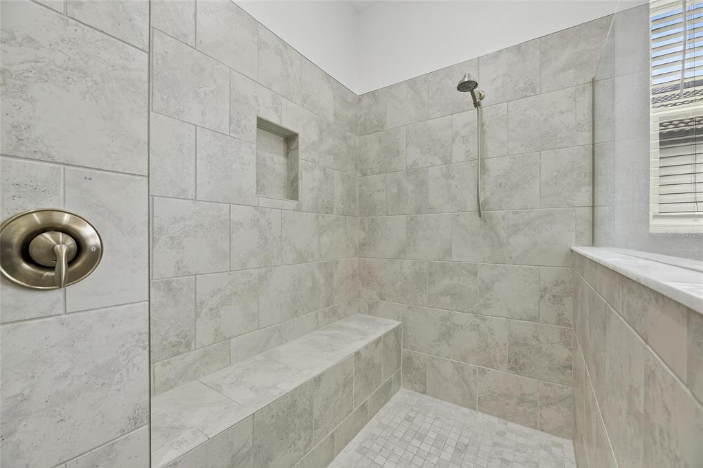 16805 Banner Shell Place Wimauma, FL 33598 - Photo 23 of 44 a bathroom with a shower