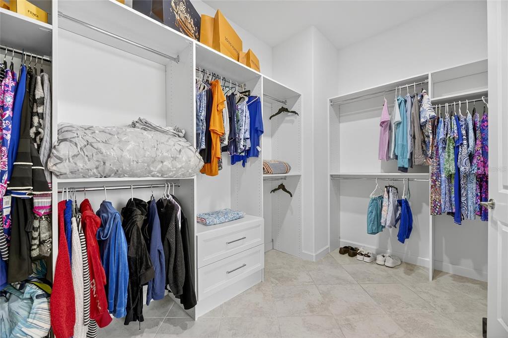 16805 Banner Shell Place Wimauma, FL 33598 - Photo 25 of 44 a view of walk in closet with clothes