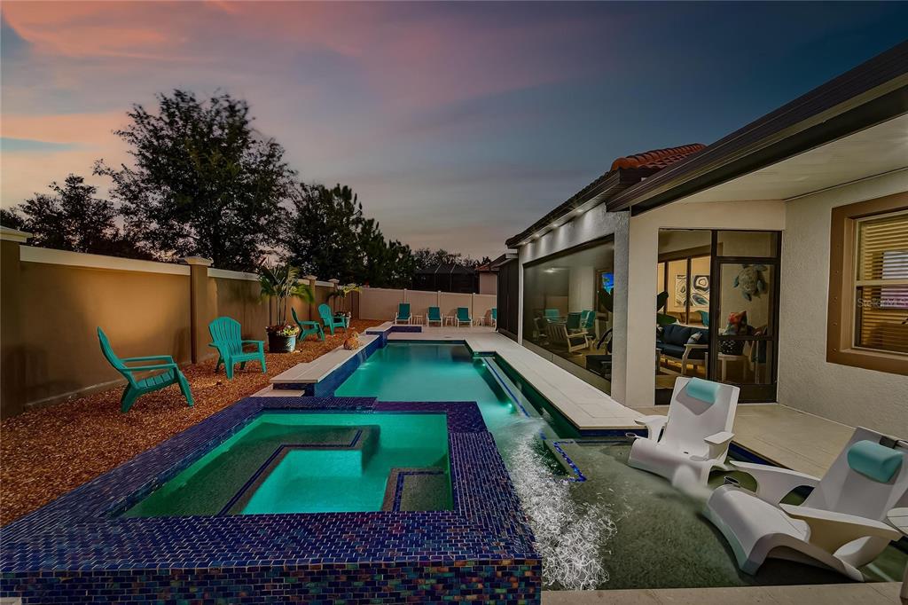 16805 Banner Shell Place Wimauma, FL 33598 - Photo 32 of 44 a childrens park with lots of swings and slides