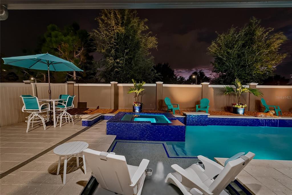 16805 Banner Shell Place Wimauma, FL 33598 - Photo 38 of 44 an outdoor space with furniture and umbrella