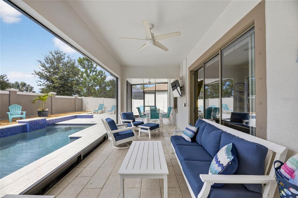 16805 Banner Shell Place Wimauma, FL 33598 - Photo 40 of 44 a living room with furniture and a large window