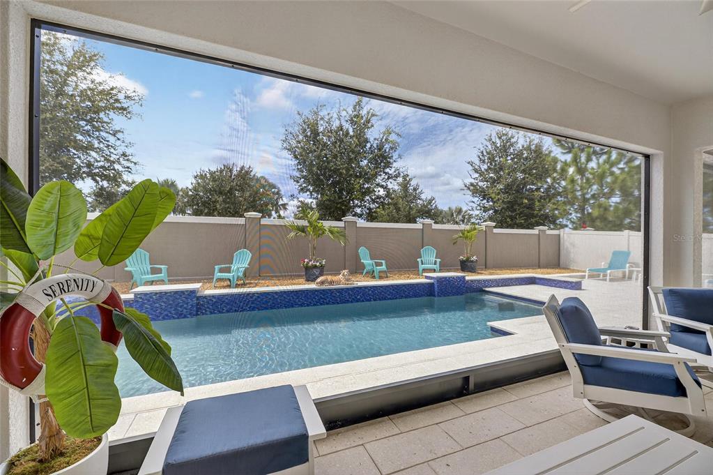 16805 Banner Shell Place Wimauma, FL 33598 - Photo 4 of 44 a living room with furniture and a large window