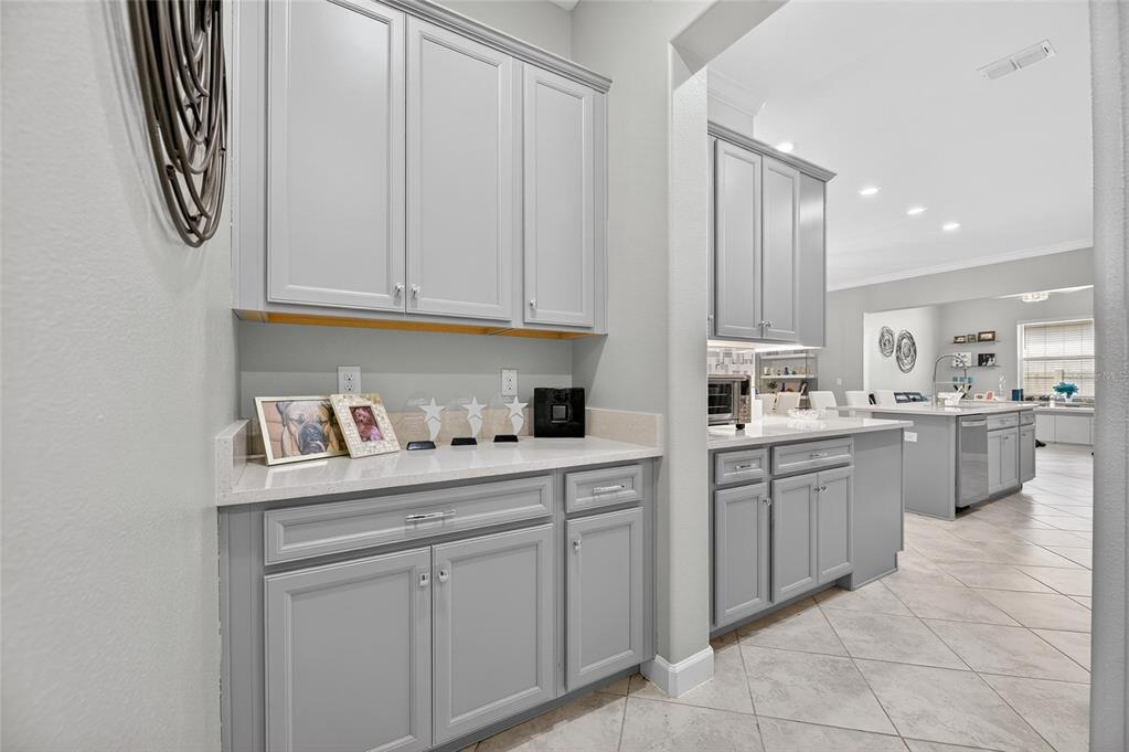 16805 Banner Shell Place Wimauma, FL 33598 - Photo 8 of 44 a kitchen with cabinets and window