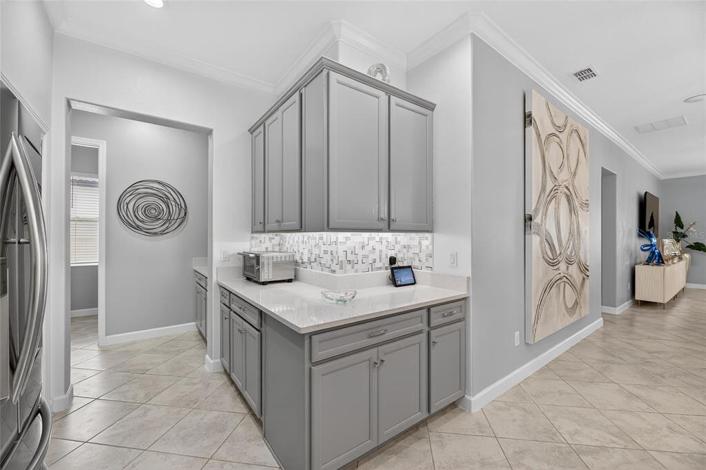 16805 Banner Shell Place Wimauma, FL 33598 - Photo 10 of 44 a bathroom with a sink a toilet and a mirror