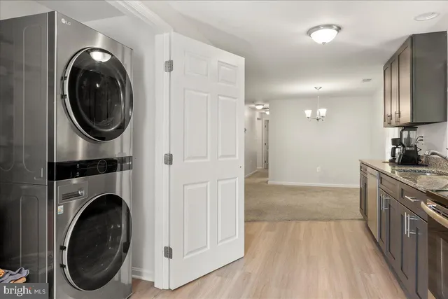 a view of a kitchen with washer and dryer