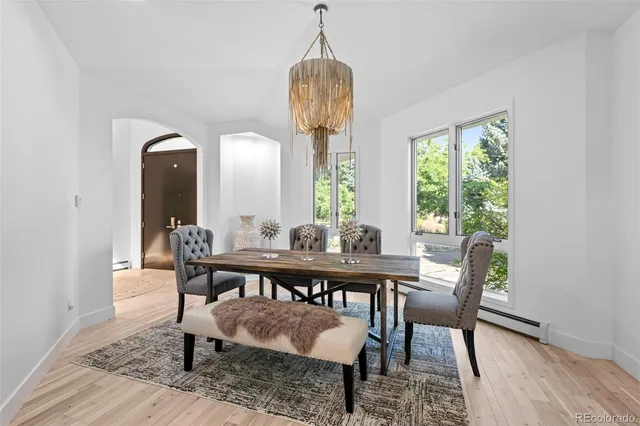 a living room with furniture and large windows