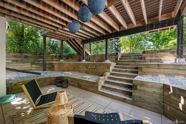 a view of a room has wooden floor and window