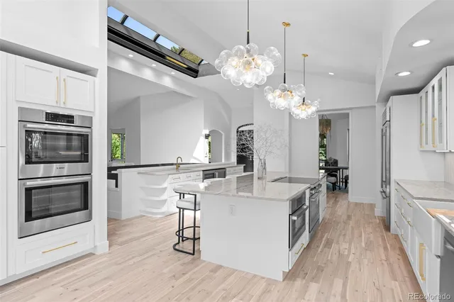 a kitchen with appliances cabinets and a sink