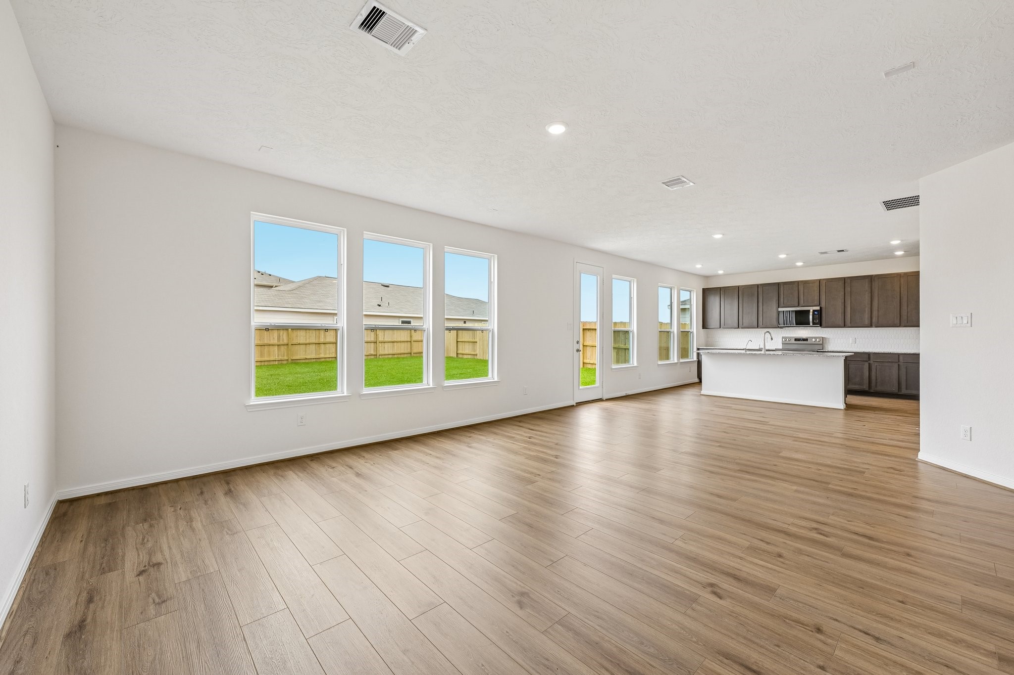 2503 Spruce Hl Road Beasley, TX 77417 - Photo 7 of 25 An entertainer’s dream! The expansive, open-concept main floor flows beautifully from room to room, keeping you connected to guests whether you're cooking in the kitchen or relaxing in the living room.