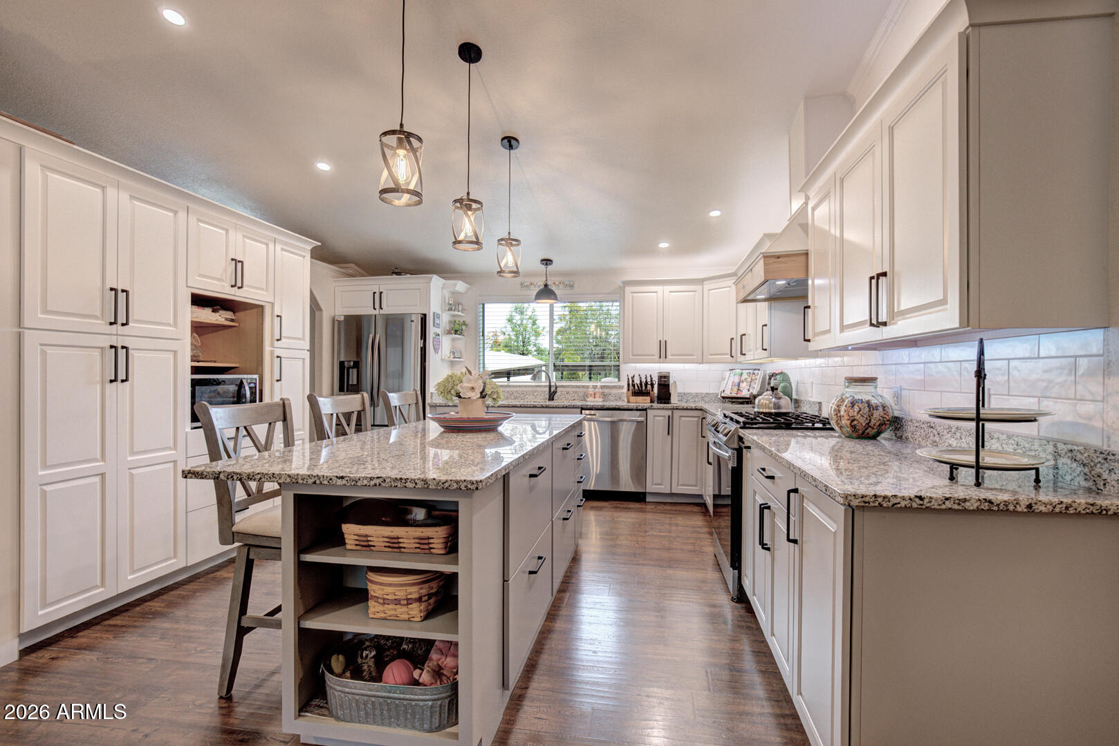 904 North McLane Road Payson, AZ 85541 - Photo 12 of 59 a kitchen with stainless steel appliances granite countertop a sink a stove and a refrigerator