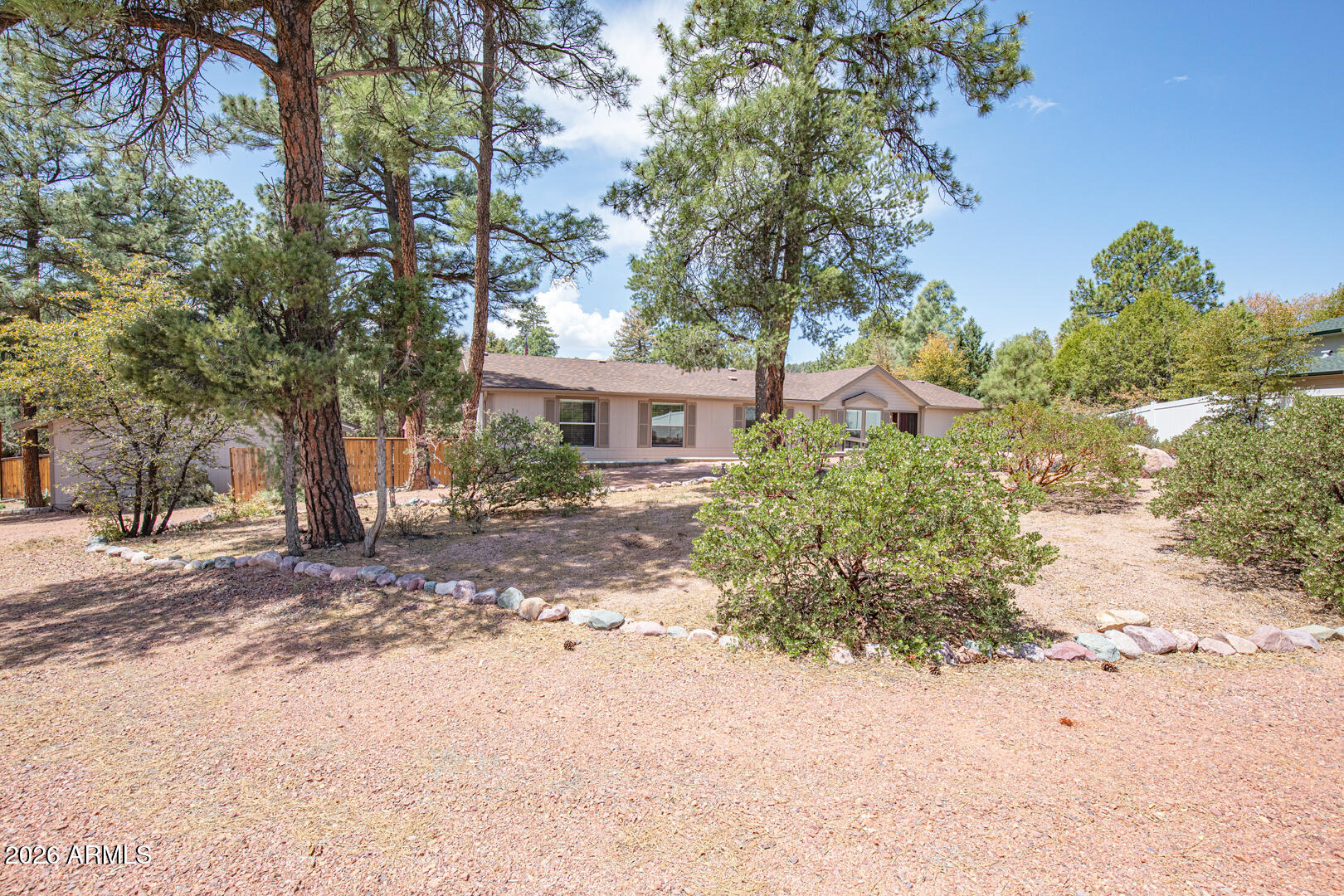904 North McLane Road Payson, AZ 85541 - Photo 14 of 59 a front view of a house with a yard and garage
