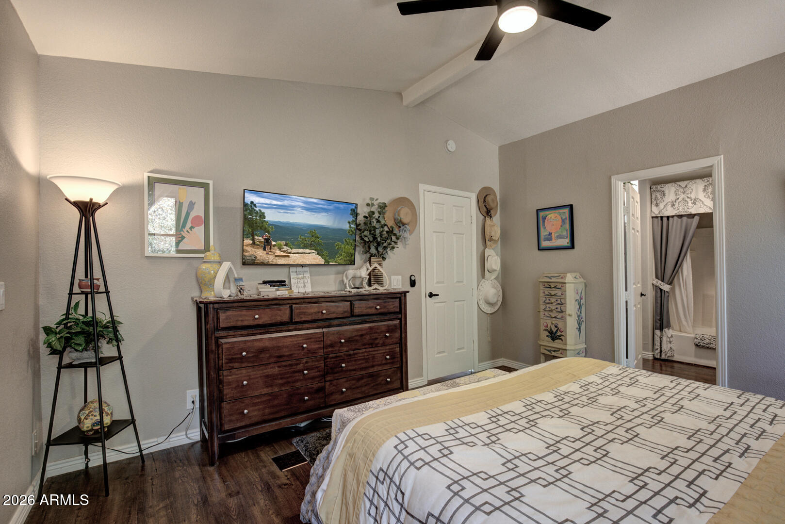 904 North McLane Road Payson, AZ 85541 - Photo 22 of 59 a bedroom with a bed and a flat tv screen on dresser
