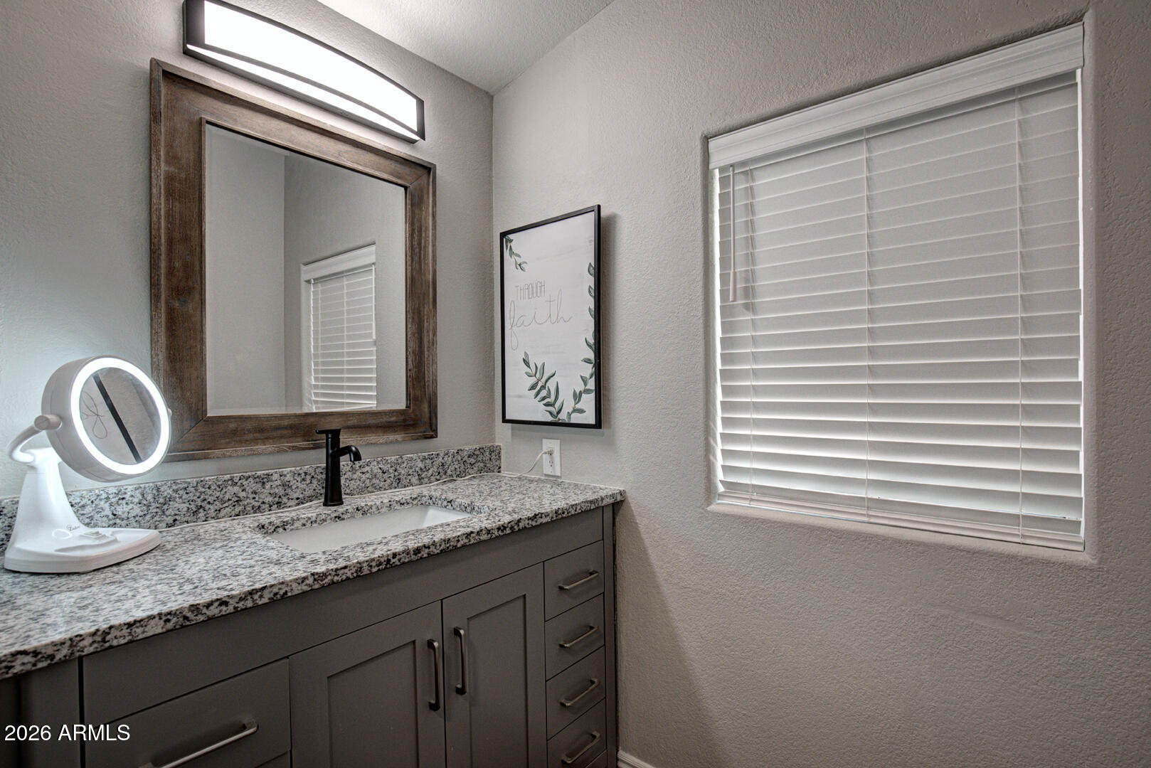 904 North McLane Road Payson, AZ 85541 - Photo 24 of 59 a bathroom with a granite countertop sink and a mirror